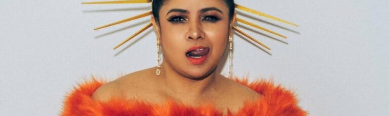 Feature-Who's That Girl? - Whats The Show Feature-Who's That Girl?